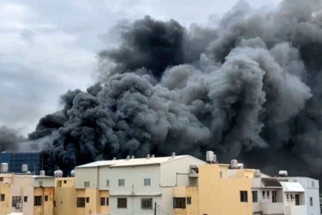 Smoke rises from a building in central Taiwan 