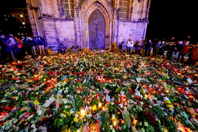 Flowers laid near site of market attack