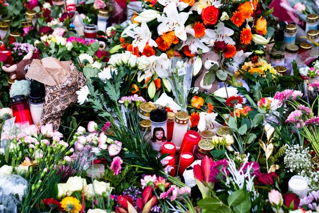 Flowers and candles left in tribute