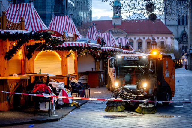 Clean-up truck at work in a Christmas market