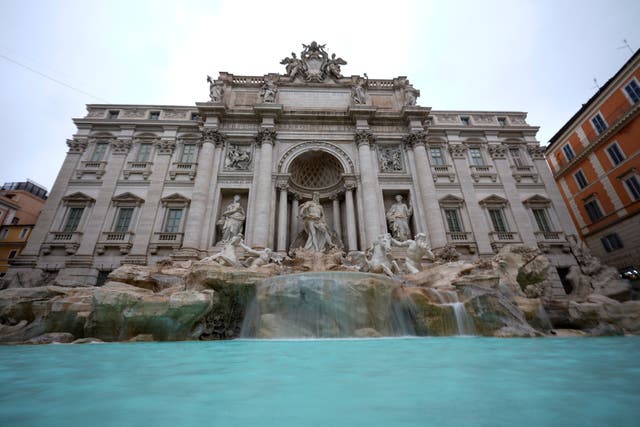 A view of the 18th century Trevi Fountain in Rome as it reopens to the public after undergoing maintenance