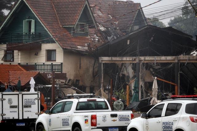 Police cordon off houses that were hit by a plane in Gramado, Rio Grande do Sul State, Brazil 