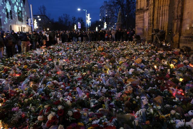 Flowers and candles close to the Christmas market in Magdeburg