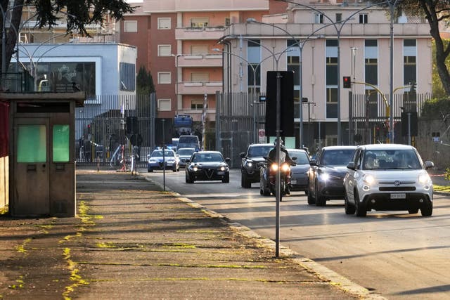 The motorcade escorting Pope Francis arrives at Rebibbia prison