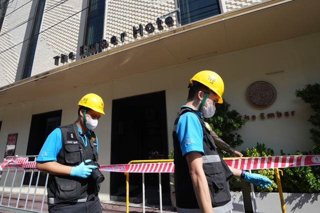 Police forensics workers outside the hotel in Bangkok 