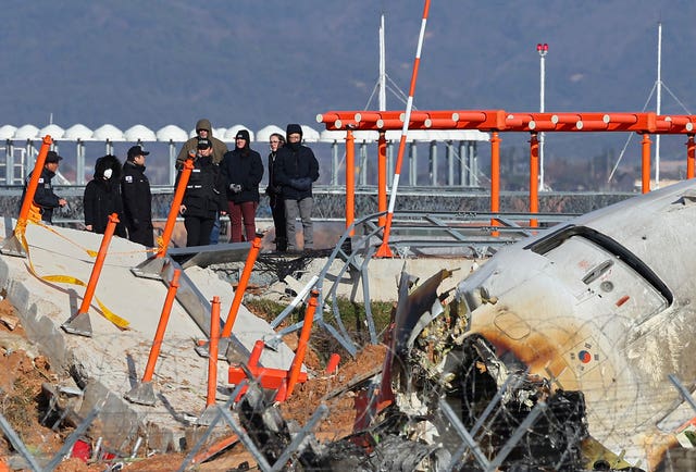 Experts at a crash site