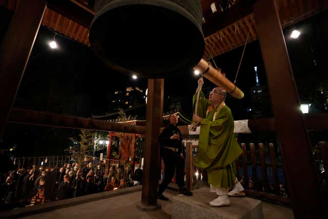 A monk hits the bell at the Bentendo Hall of Sensoji Buddhist temple as participating in a bell-ringing ritual called Joya no Kane on New Year’s Day in Tokyo