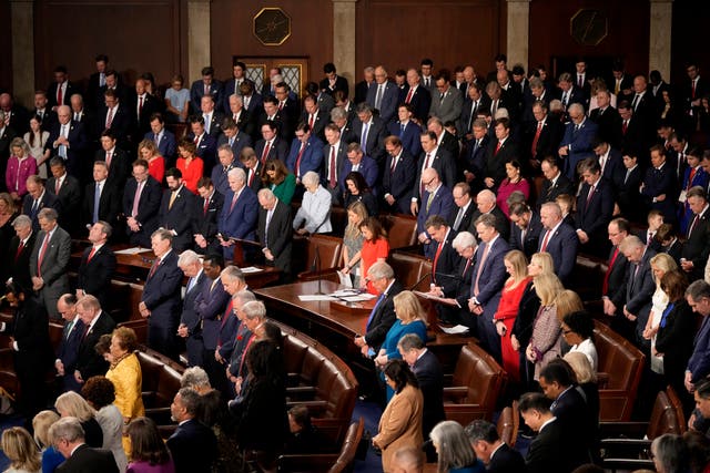 Members bow their heads during a moment of silence for the victims of the attack in New Orleans as the House of Representatives meets to elect a speaker and convene the new 119th Congress at the Capitol in Washington 