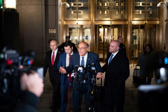 Rudy Giuliani speaks to the media outside of Manhattan federal court 