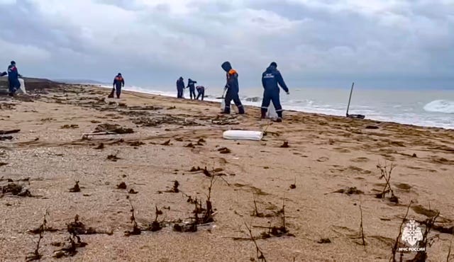 Volunteers work on the beach