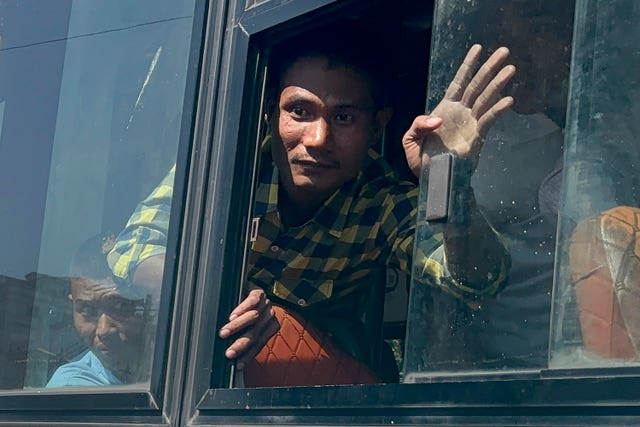 A released inmate waves