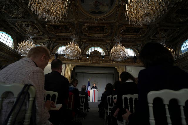 Mr Macron speaks at the palace