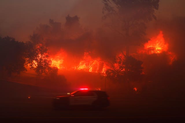 The Palisades Fire burns a property in the Pacific Palisades neighborhood of Los Angeles