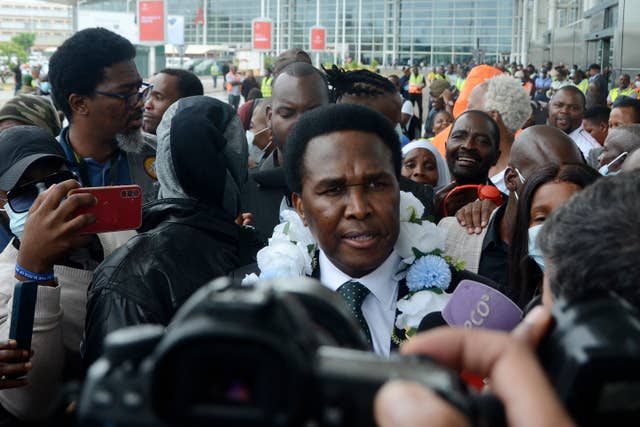 Mozambique’s opposition leader Venancio Mondlane speaks to journalist on arrival at the Mavalane International Airport in Maputo, Mozambique