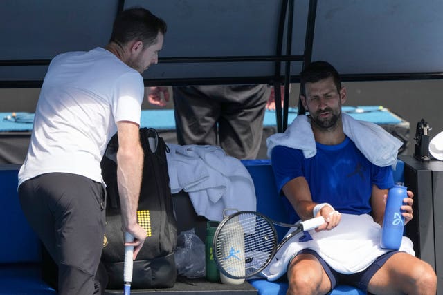 Andy Murray, left, talks to Novak Djokovic 