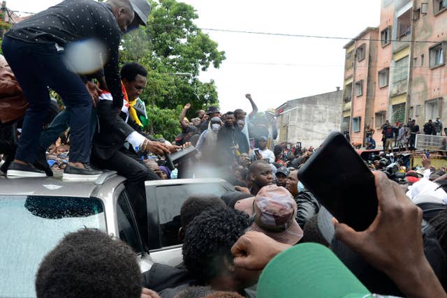 Mozambique’s opposition leader Venancio Mondlane addresses supporters from the top of a vehicle on the street in Maputo, Mozambique