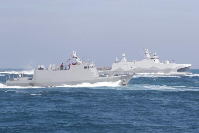 A Tuo Chiang patrol ship and a Kuang Hua VI-class missile boat during a simulated attack drill 