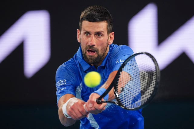 Novak Djokovic plays a backhand at Melbourne Park