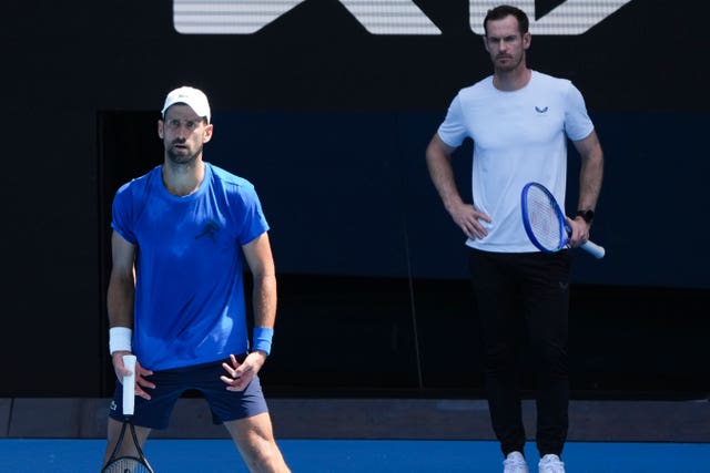 Andy Murray, right, watches Novak Djokovic practise