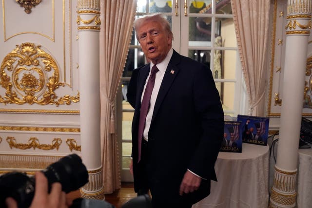 President-elect Donald Trump arrives to speak during a meeting with Republican governors at Mar-a-Lago in Palm Beach, Florida 