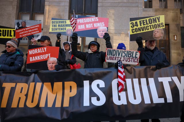 Demonstrators protest outside Manhattan criminal court before the start of the sentencing in President-elect Donald Trump’s hush money case in New York 