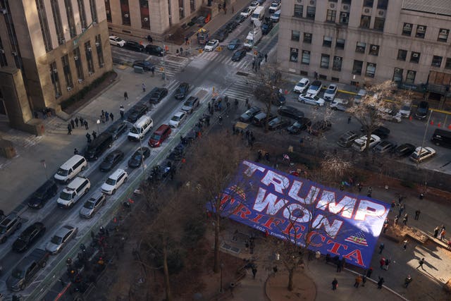 Trump supporters display a banner reading Trump Won outside Manhattan criminal court, seen from above