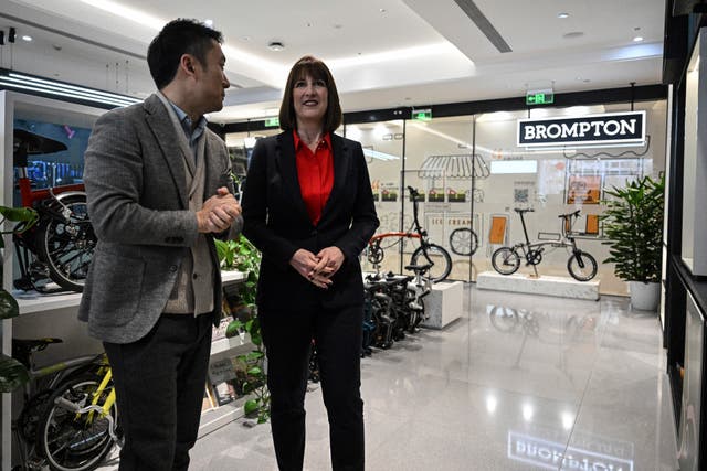 Rachel Reeves, right, visits a Brompton flagship store in Beijing