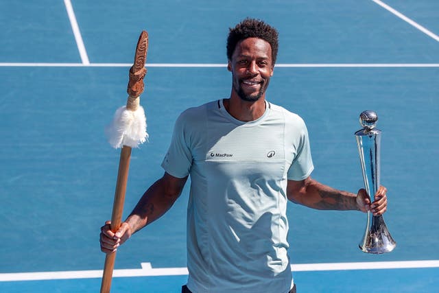 Gael Monfils holds the trophy in Auckland 