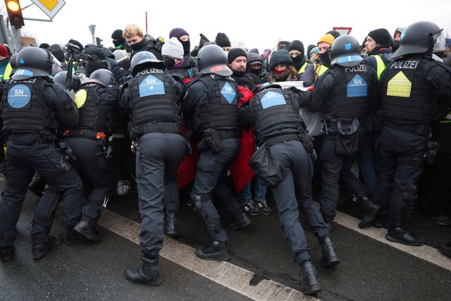 Police push back protesters