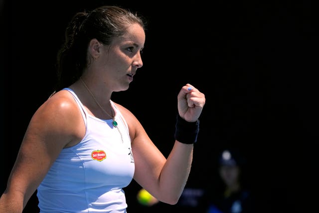 Jodie Burrage clenches her fist after winning a point