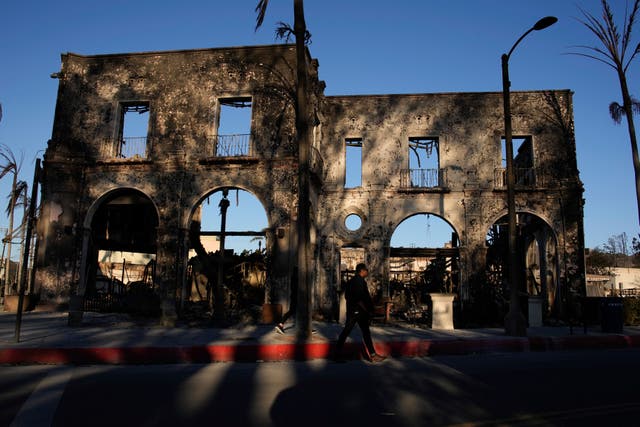 The front face of a building is all that is left standing 