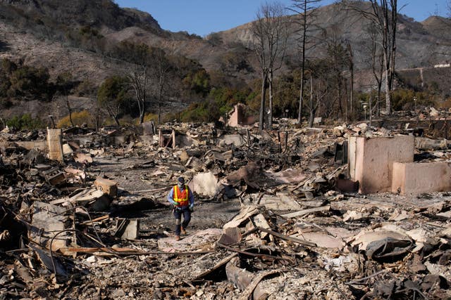 Workers survey the damage