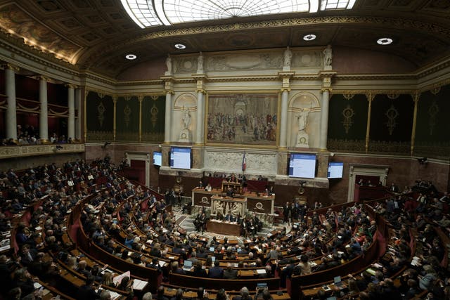 Legislators listen to French Prime Minister Francois Bayrou delivering his general policy speech at the National Assembly in Paris