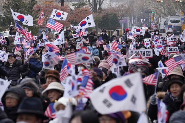 Supporters of impeached South Korean President Yoon Suk Yeol shout slogans during a rally to oppose his impeachment near the Constitutional Court in Seoul