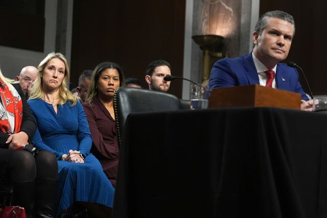 Jennifer Rauchet, left, listens with her husband Pete Hegseth, right, President-elect Donald Trump’s choice to be defence secretary, appearing before the Senate Armed Services Committee for his confirmation hearing, at the Capitol in Washington