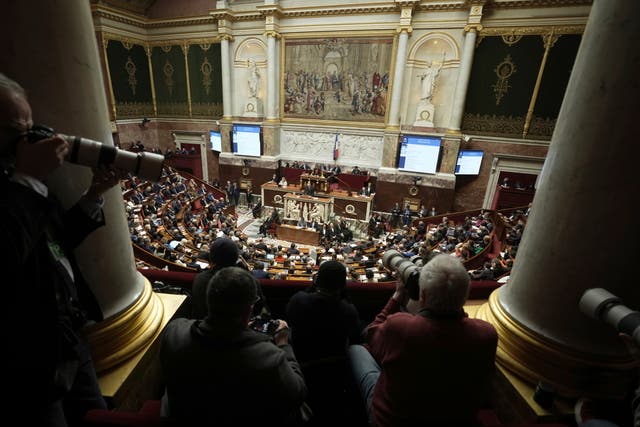 Press photographers focus on French prime minister Francois Bayrou delivering his general policy speech at the National Assembly in Paris 