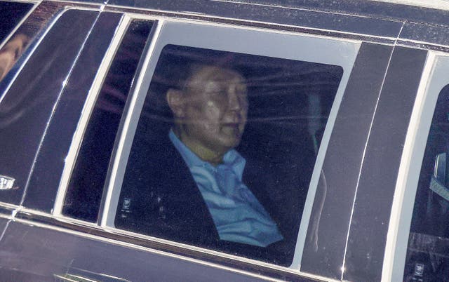 South Korean President Yoon Suk Yeol sitting in a car 