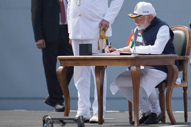 Narendra Modi sat at the ceremony