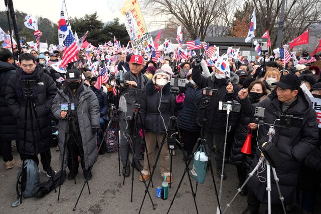 Supporters of Mr Yoon stage a rally to oppose his impeachment outside a detention centre in Uiwang, South Korea