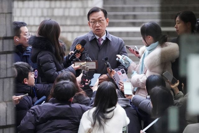 A lawyer speaking to the media outside the Seoul Central District Court