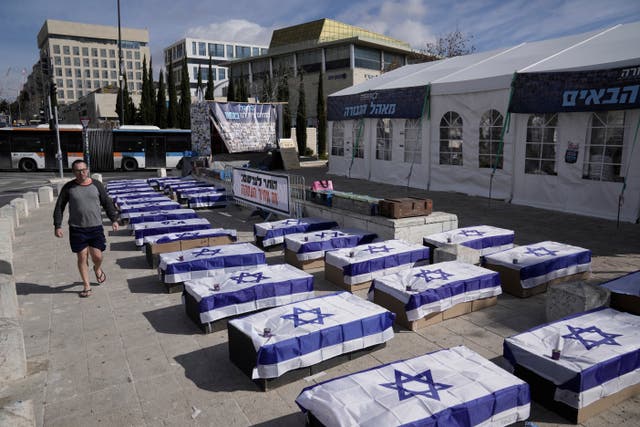 Symbolic coffins are displayed in Jerusalem to protest against a hostage deal