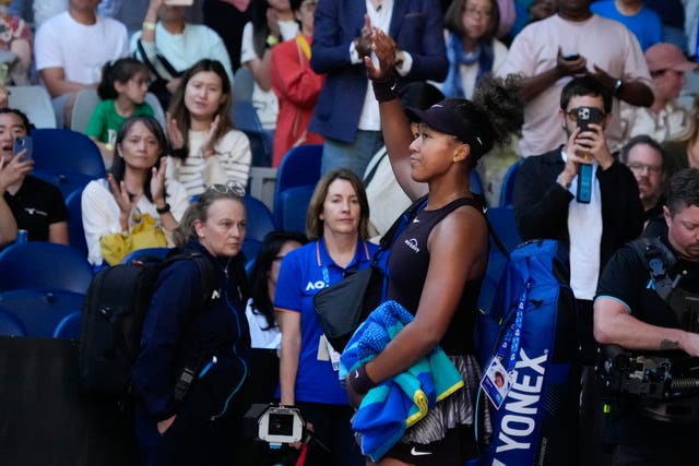 Naomi Osaka waves to the crowd after retiring mid-match