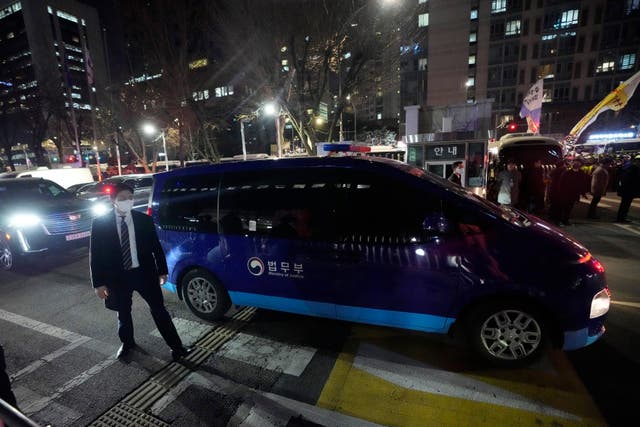 A vehicle carrying impeached South Korean President Yoon Suk Yeol leaves the Seoul Western District Court