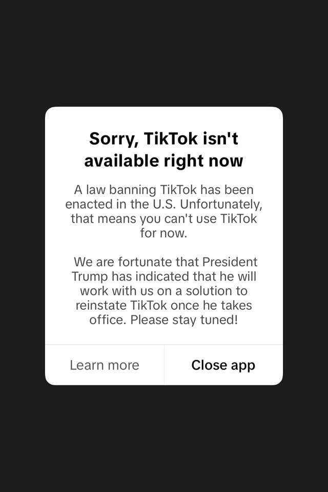 Screenshot from a cell phone displaying a message from the TikTok app reading “Sorry, TikTok isn’t available right now” 