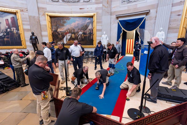 Organisers work to move the Inauguration Day swearing-in ceremony into the Capitol Rotunda 