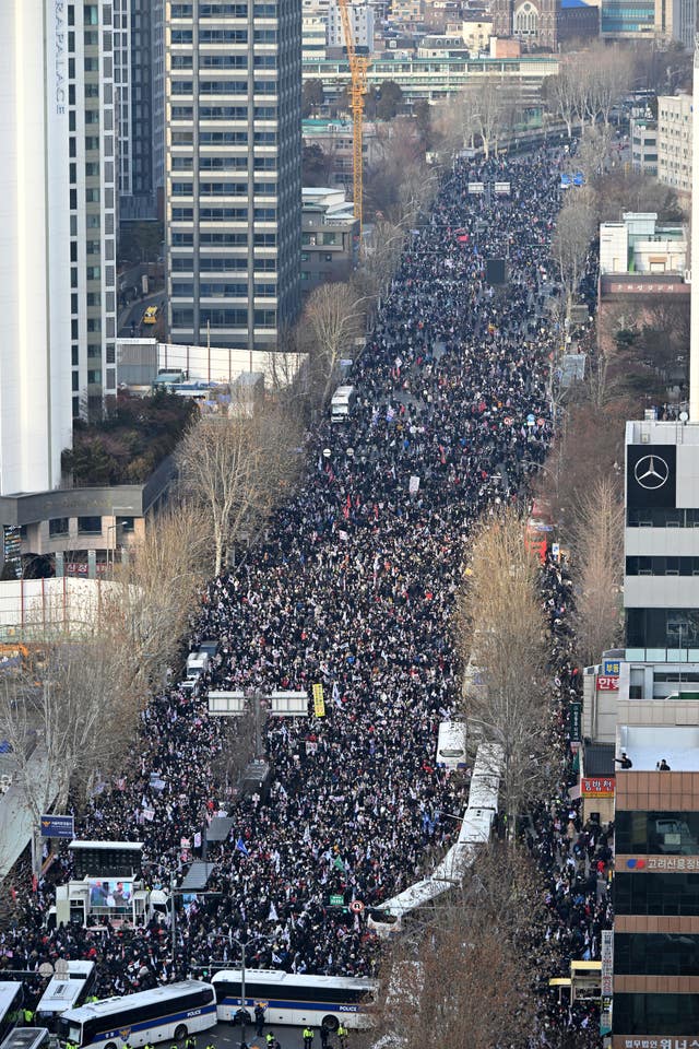 Supporters of impeached South Korean President Yoon Suk Yeol gather outside the Seoul Western District Court