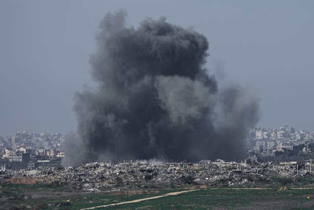 Smoke rises from damaged buildings