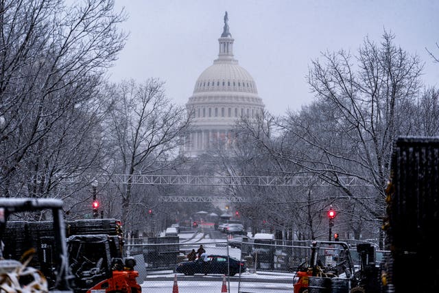 Snow falls on the US Capitol