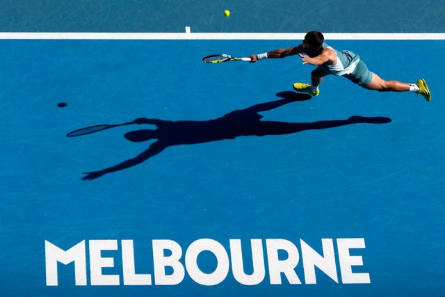 Carlos Alcaraz hits a backhand