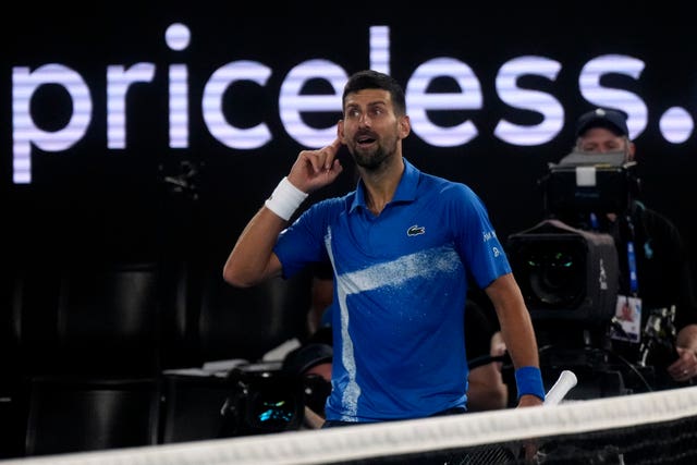 Novak Djokovic gestures to the crowd